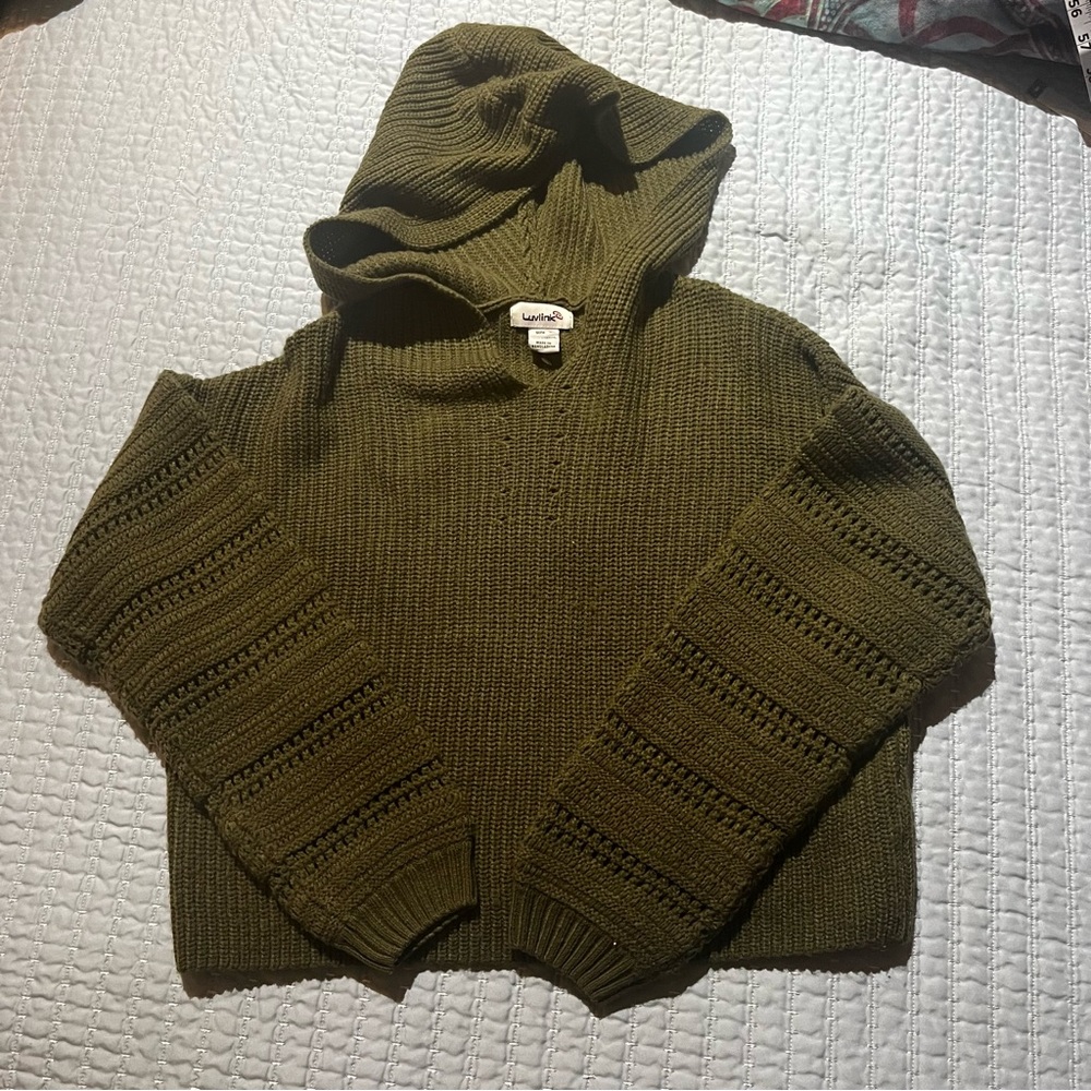 Green knitted sweater with a hood